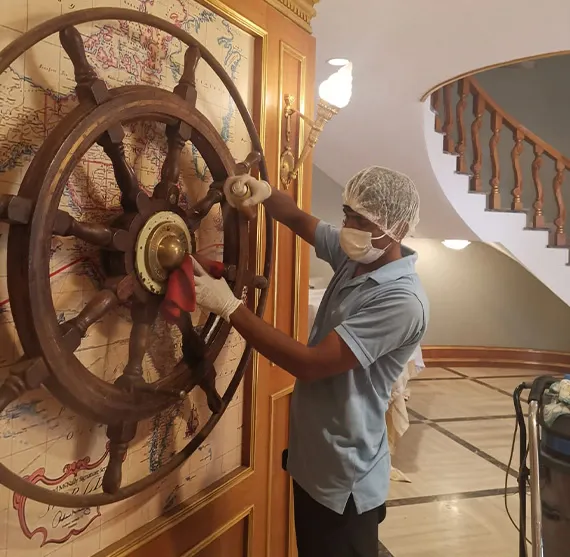 Cleaning Ship wheel inside a house